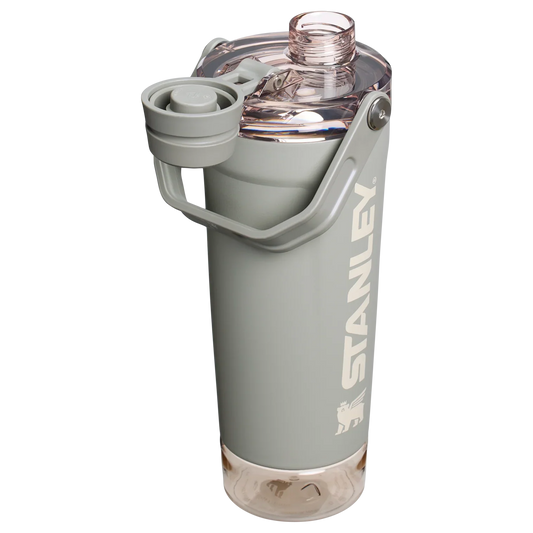 A black Stanley Activate Shaker Bottle with an open tethered cap, showing the lid and carry handle design.
