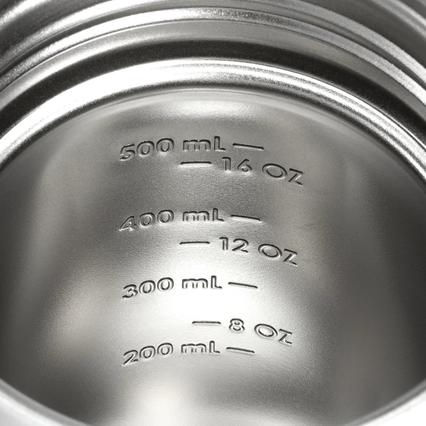 Close-up of the stamped measurement markings inside the Stanley Activate Shaker Bottle, displaying ounces and milliliters.
